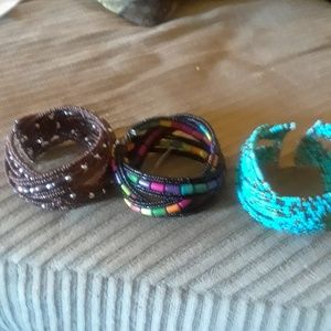 Three cuff bracelets.